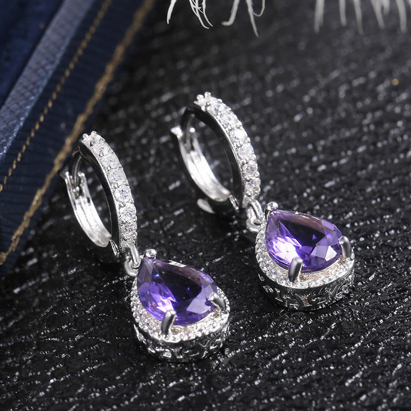 Prong set purple gemstone earrings