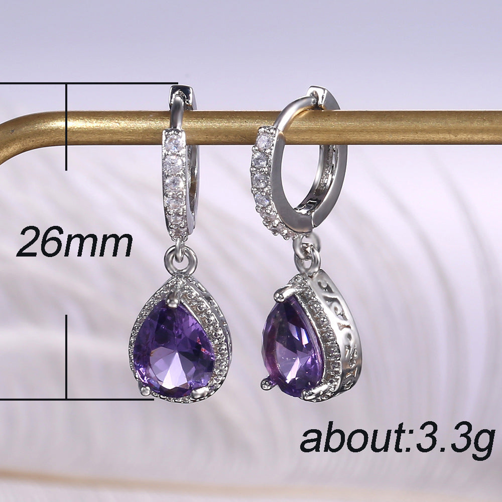 Prong set purple gemstone earrings