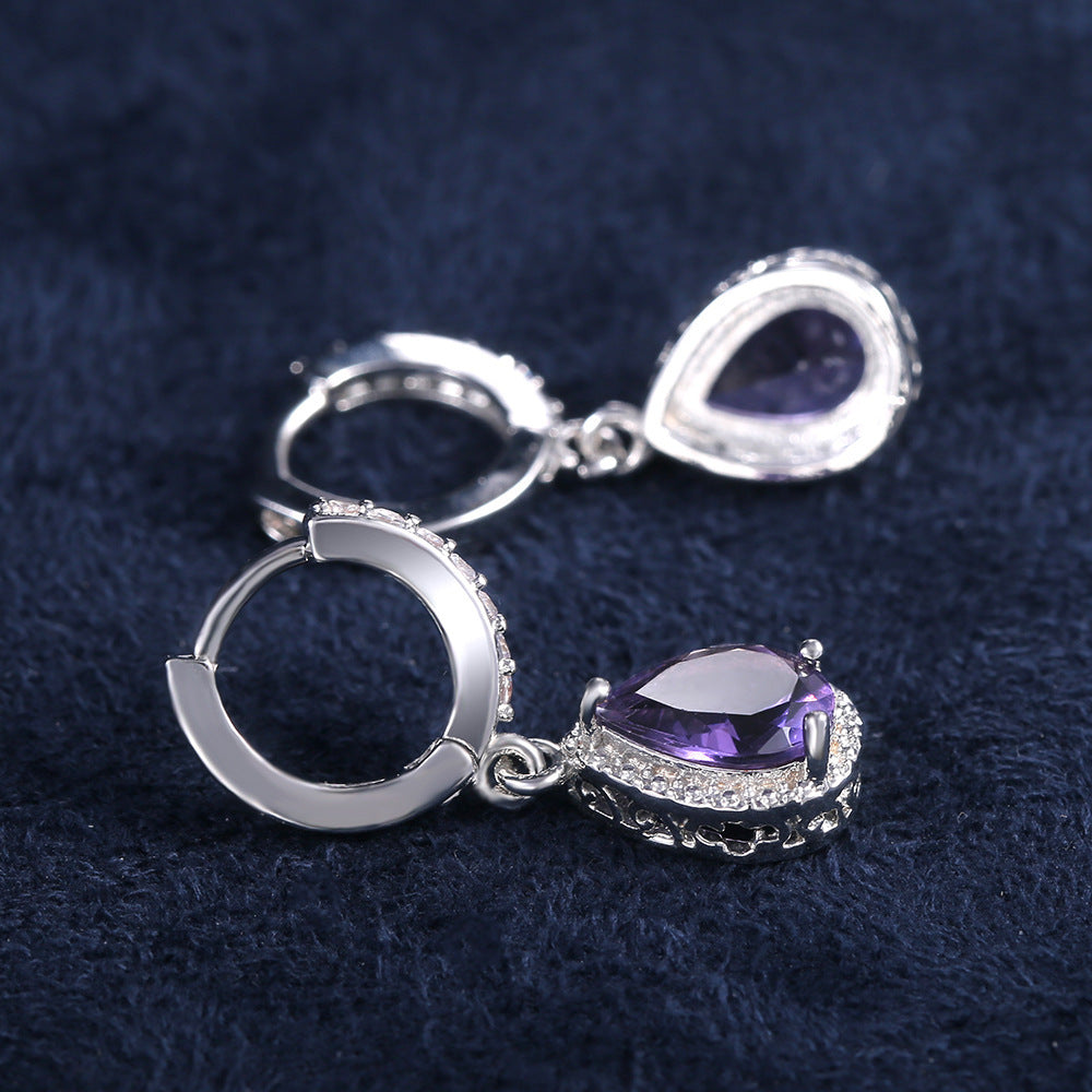 Prong set purple gemstone earrings