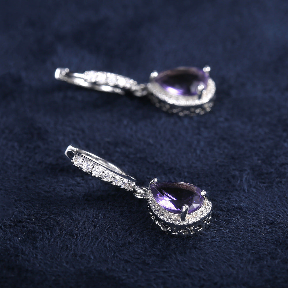 Prong set purple gemstone earrings