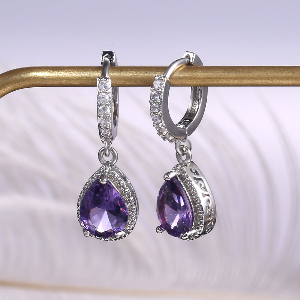 Prong set purple gemstone earrings