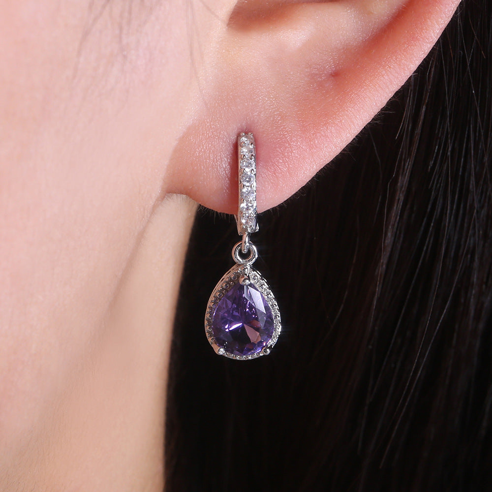 Prong set purple gemstone earrings