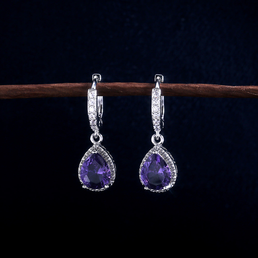 Prong set purple gemstone earrings