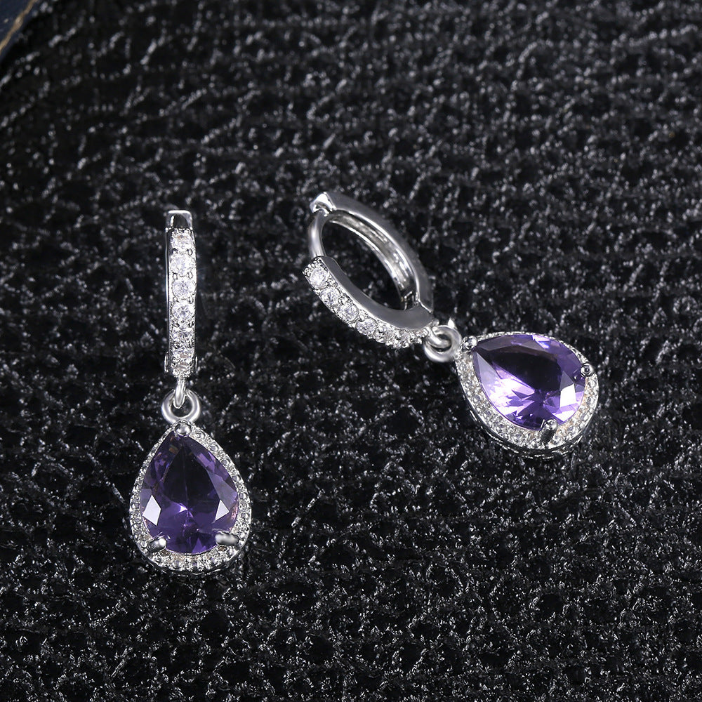Prong set purple gemstone earrings